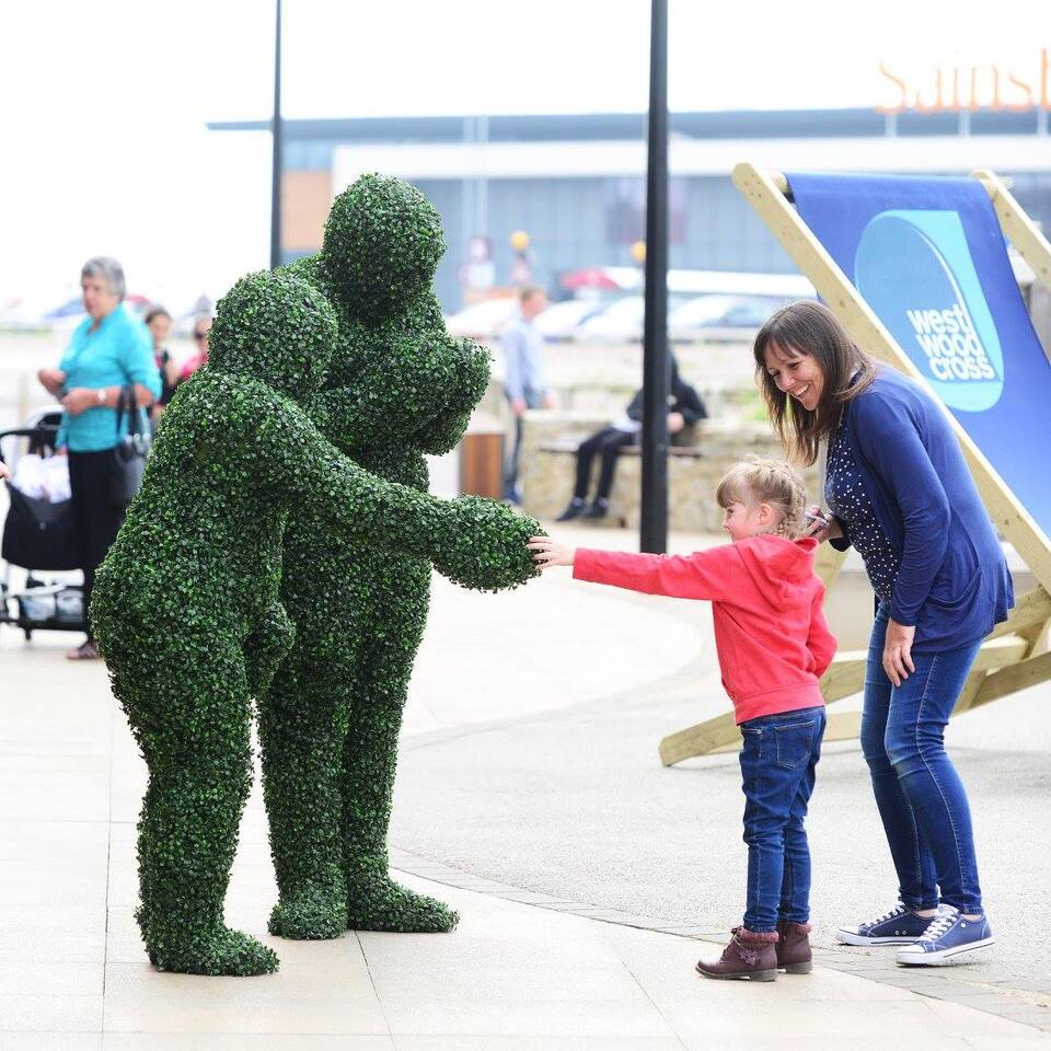 The Human Hedges performing at s shopping centre in Kent